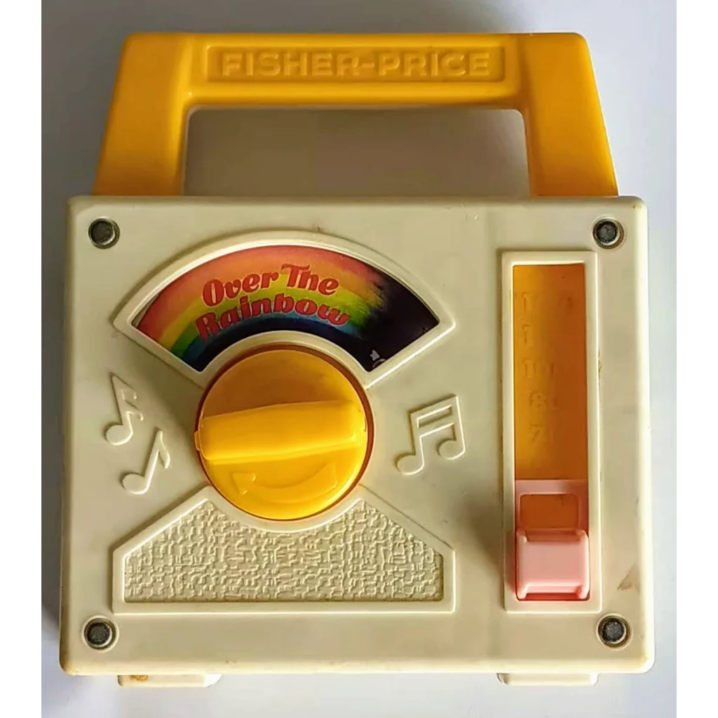 Vintage Fisher Price rainbow music box with yellow white plastic dial