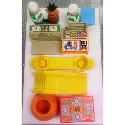 Vintage Fisher-Price Sesame Street playset with colorful toys and figurines