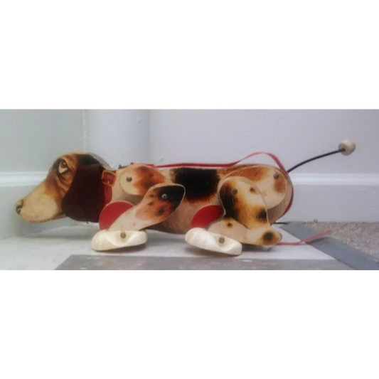 Vintage 1961 Fisher Price Snoopy pull toy: wooden dog with red black spots