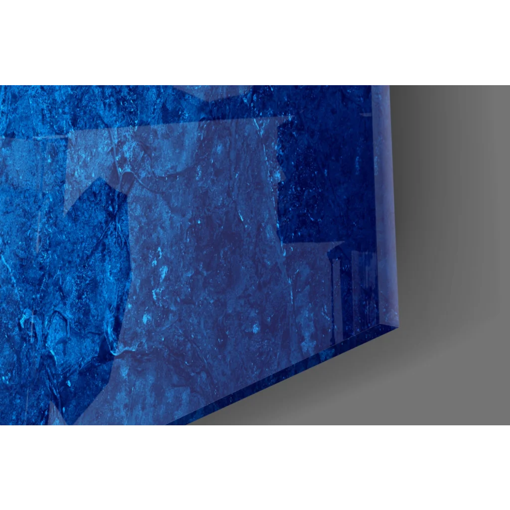 Vibrant blue textured glass wall art with glossy marbled finish