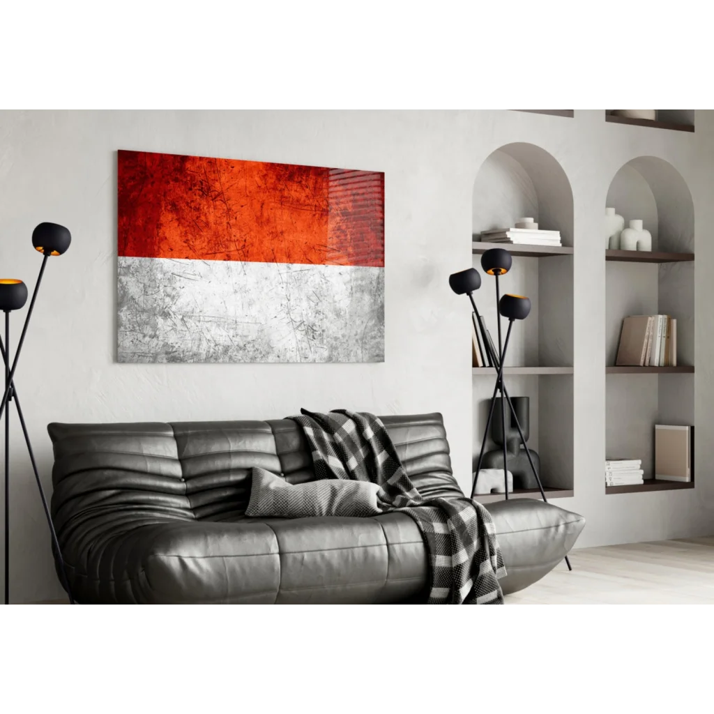 Bold red abstract glass wall art with silver metallic texture above sofa