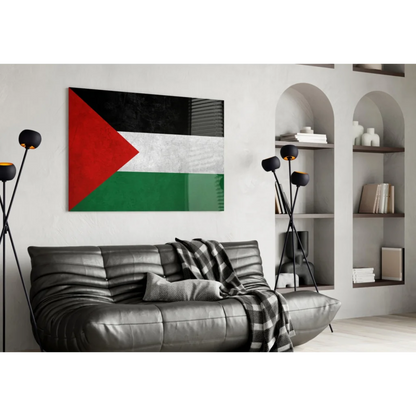 Modern black leather sofa with plaid blanket and Palestinian flag wall art