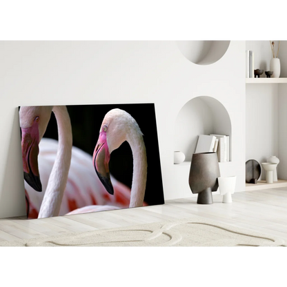 Close-up of two pink flamingos on stunning glass wall art canvas print