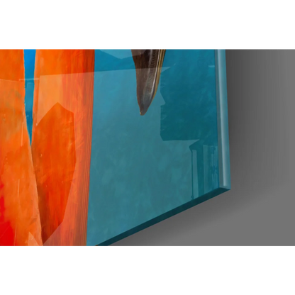 Vibrant orange flamingo glass wall art on teal abstract panel