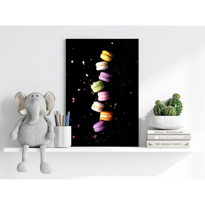 Vibrant floating macarons canvas print on black aluminum