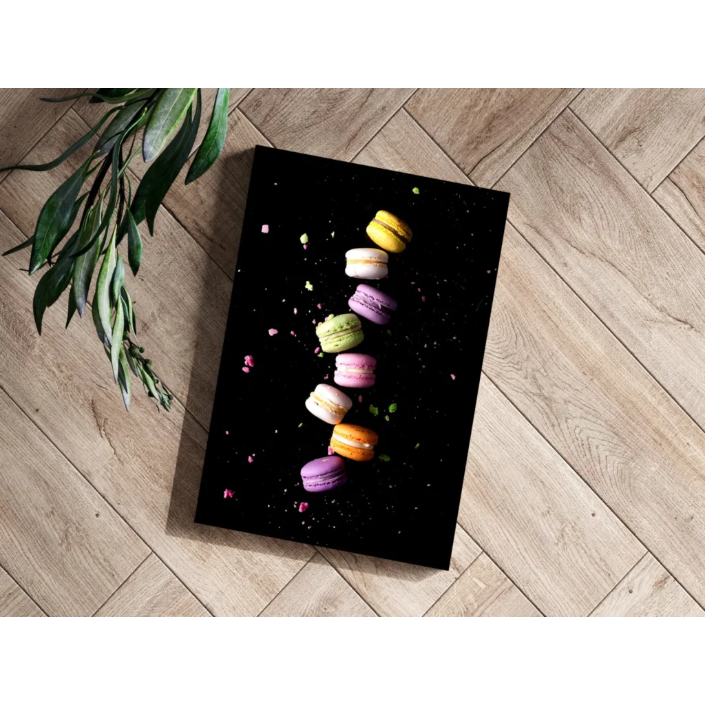 Colorful pastel macarons on black floating canvas print
