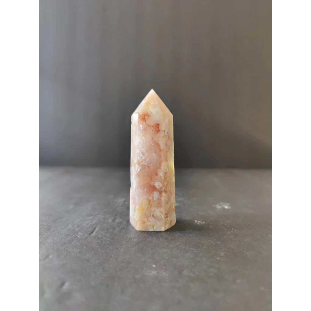 Translucent peach and cream flower agate tower quartz crystal with natural mineral inclusions