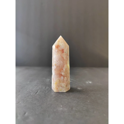 Translucent peach and cream flower agate tower quartz crystal with natural mineral inclusions