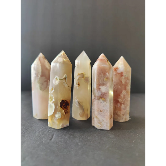 Five translucent flower agate tower crystal points with creamy white and warm pinkish-brown natural patterns