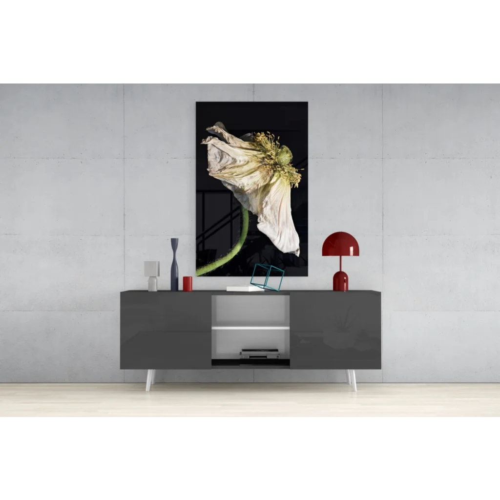 Black-and-white wilted poppy glass wall art on gray console