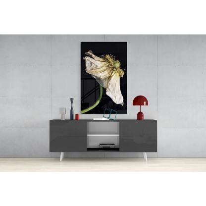 Black-and-white wilted poppy glass wall art on gray console