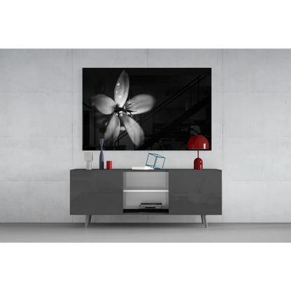 Black-and-white floral wall art canvas print above gray console table