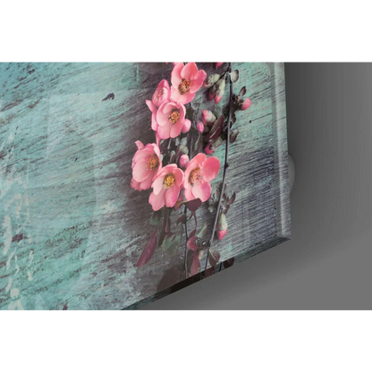 Stunning glass wall art of pink flowers on teal wood background