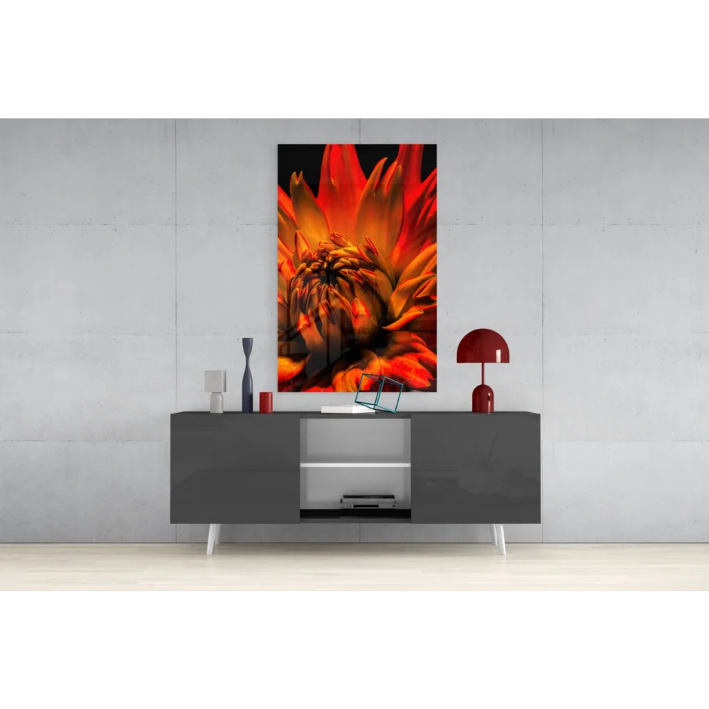 Vibrant orange red dahlia glass wall art print above gray console