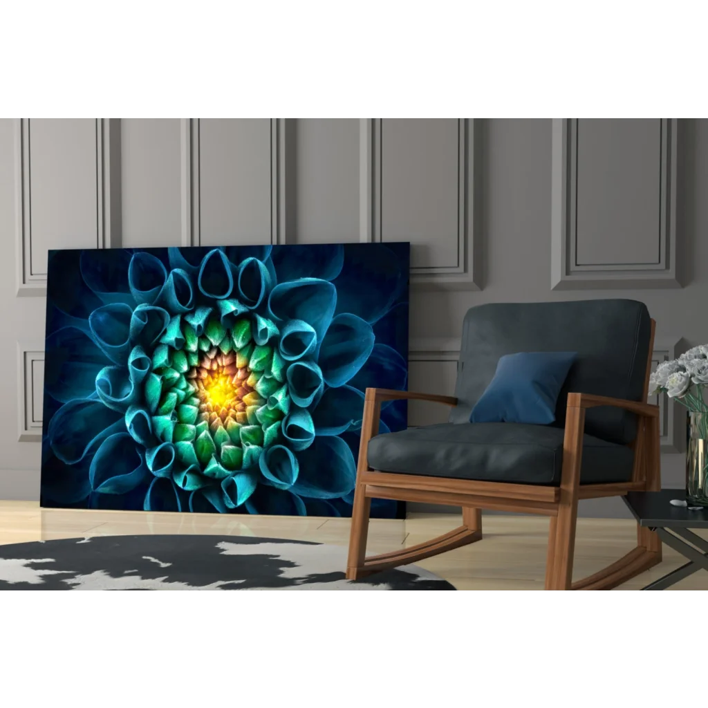 Vibrant blue green abstract floral glass wall art with yellow center on wall