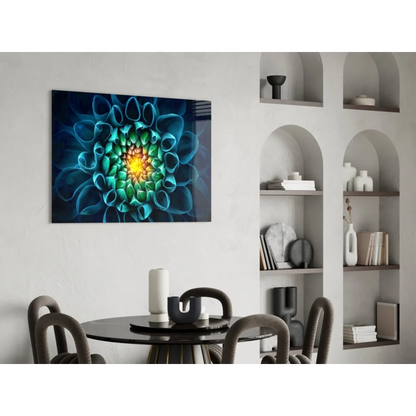 Vibrant blue and green glass wall art with radiant yellow floral center in black frame