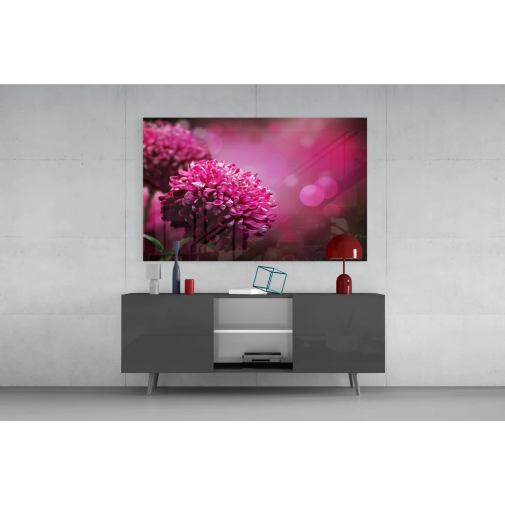 Vibrant pink chrysanthemum glass wall art with bokeh glow above gray console
