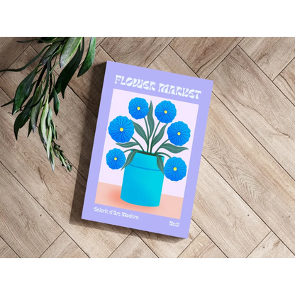 Lavender-covered Flower Market magazine with blue blooms in turquoise vase on aluminum print