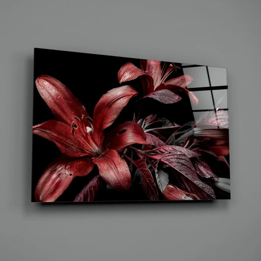 Vibrant red lily glass wall art on sleek black canvas