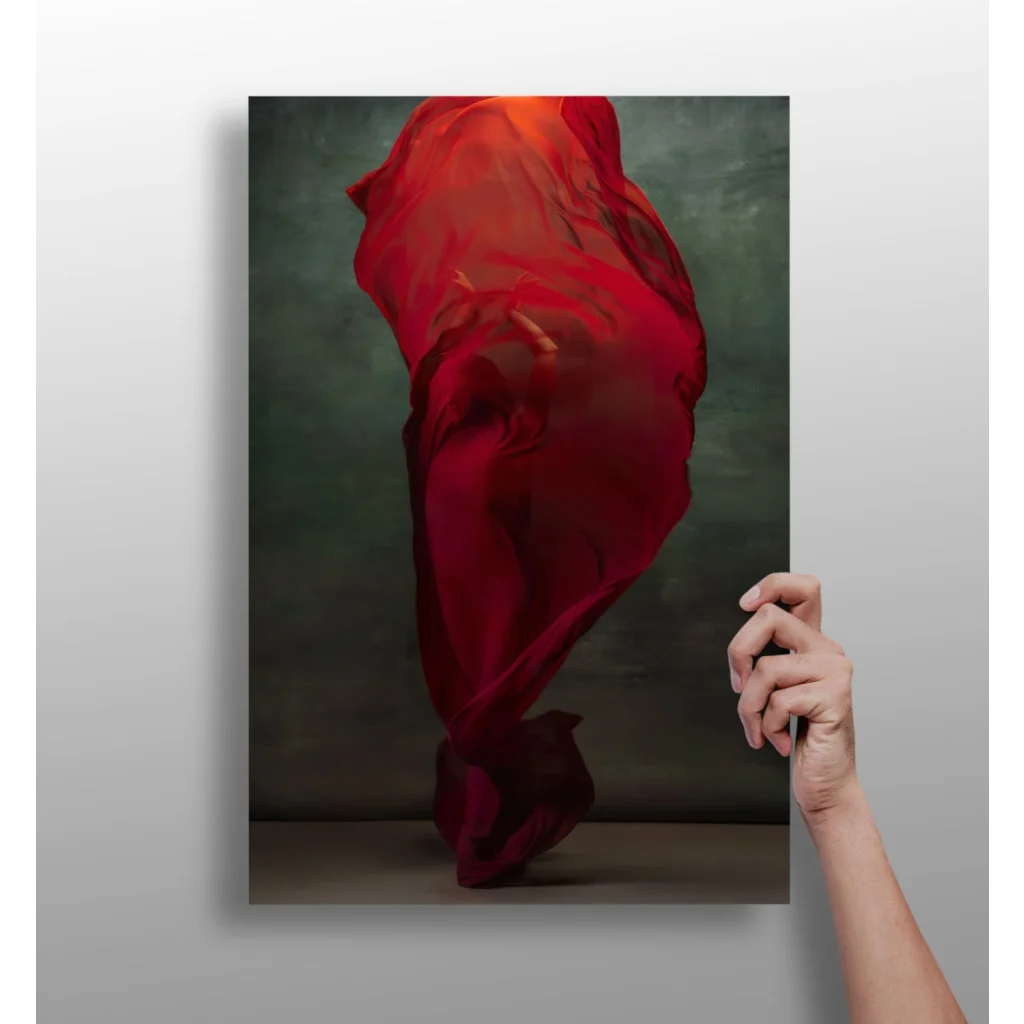 Vibrant red flowing fabric swirl on muted green aluminum art print for modern homes