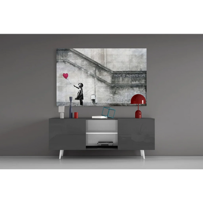 Gray minimalist console table with white legs and open shelving under There Is Always Hope heart balloon wall art