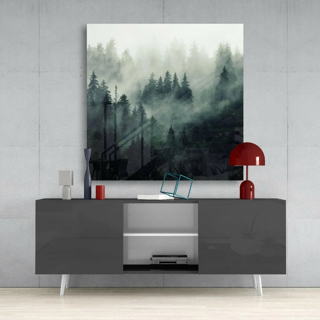 Modern matte gray console table with white tapered legs under Misty Forest glass wall art