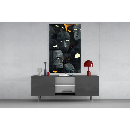 Striking black orange abstract wall art with glowing yellow eyes faces