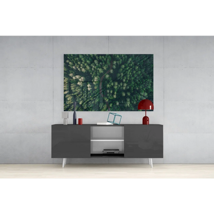 Modern gray console table with white legs and open shelving under Lush Forest Path glass wall art