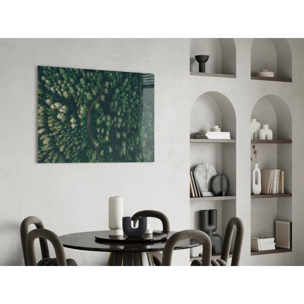 Aerial view of winding road in lush green forest on glass wall art