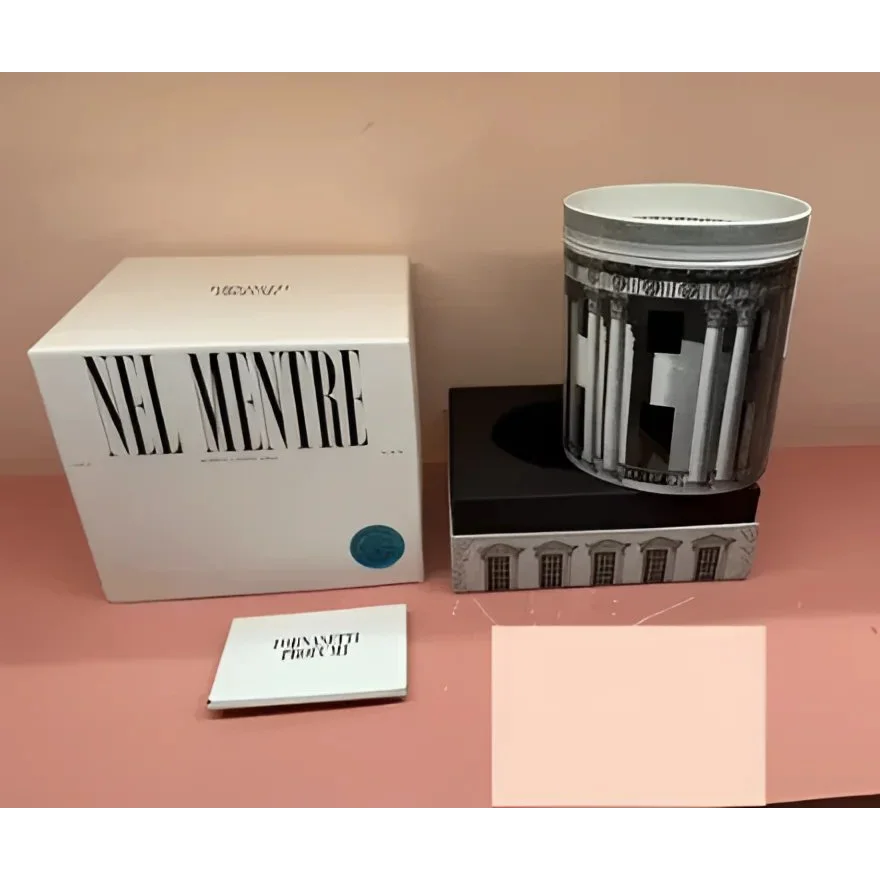 White boxed Fornasetti Nel Mentre Large Scented Candle with teal accent dot