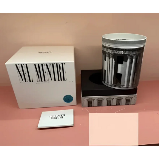 White boxed Fornasetti Nel Mentre Large Scented Candle with teal accent dot