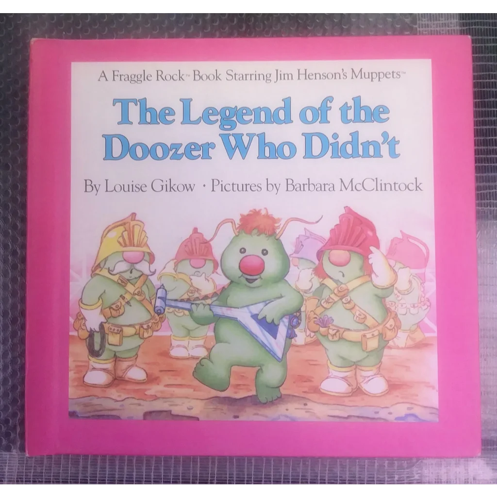 Vintage 1984 Fraggle Rock book with pink cover and Doozer illustration