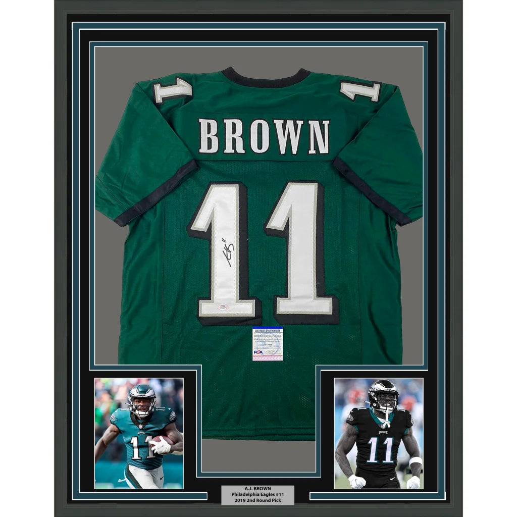 Framed autographed green Philadelphia Eagles jersey with white lettering
