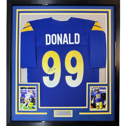 Framed autographed los angeles rams royal blue football jersey with donald 99 name and signed details with jsa coa