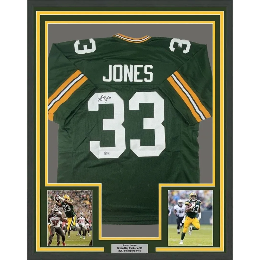 Back side of a framed autographed Aaron Jones green and yellow Green Bay Packers football jersey with number 33