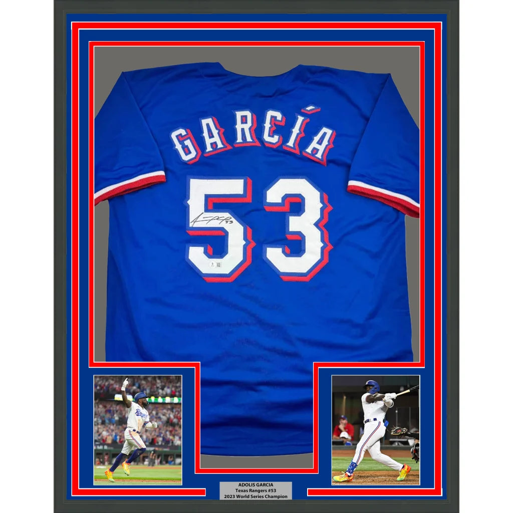 Autographed Blue Baseball Jersey Number 5 in a frame with player photos and plaque