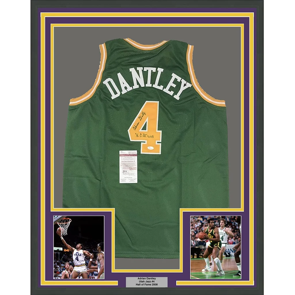Green mesh basketball jersey with white and gold trim featuring dantley above number 4 from utah signed framed