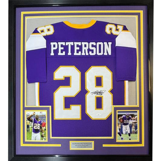 Framed Adrian Peterson Minnesota Vikings #28 signed jersey with player photos on display