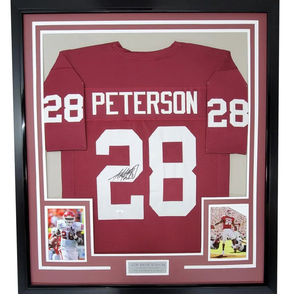 Framed autographed maroon and white football jersey with photos for display