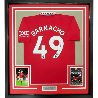 Framed signed Manchester United Garnacho 49 football jersey with photos on display