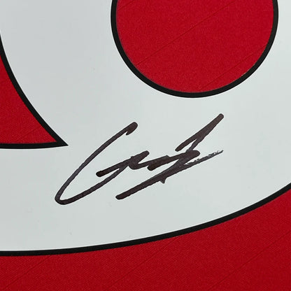 Autographed Garnacho Manchester United jersey with photos on display