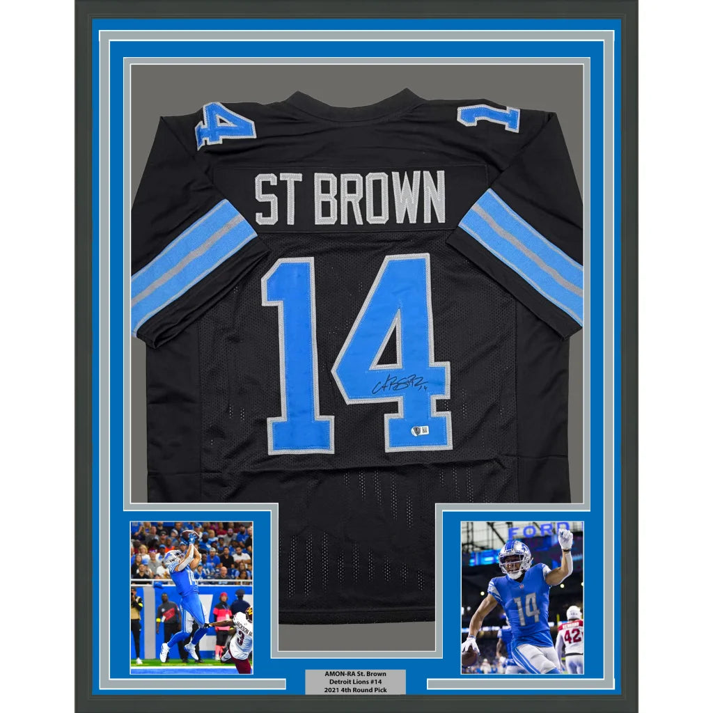 Framed Autographed Amon-Ra St. Brown 35x39 Detroit Black Football Jersey Beckett BAS COA | Hall of Fame Sports Memorabilia | vintageantiquesgifts.com