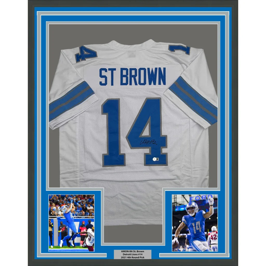 Framed Autographed Amon-Ra St. Brown 35x39 Detroit White Football Jersey Beckett BAS COA | Hall of Fame Sports Memorabilia | vintageantiquesgifts.com