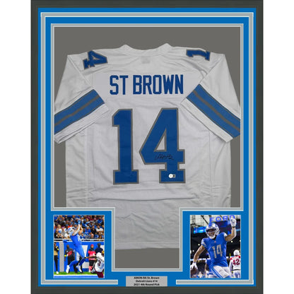 Framed Autographed Amon-Ra St. Brown 35x39 Detroit White Football Jersey Beckett BAS COA | Hall of Fame Sports Memorabilia | vintageantiquesgifts.com