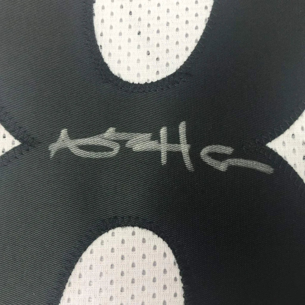 Framed autographed Antonio Brown Pittsburgh Steelers white jersey back with gray signature on black and white mesh fabric