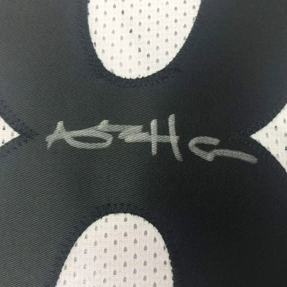 Framed autographed Antonio Brown Pittsburgh Steelers white jersey back with gray signature on black and white mesh fabric