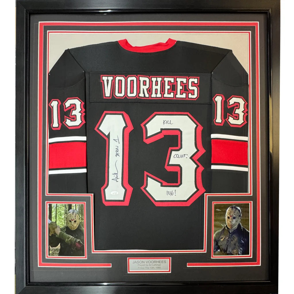 Back of a black hockey jersey with red and white accents featuring voorhees name and number 13 signed by Ari Lehman