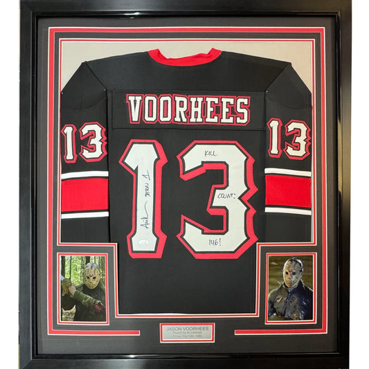 Back of a black hockey jersey with red and white accents featuring voorhees name and number 13 signed by Ari Lehman