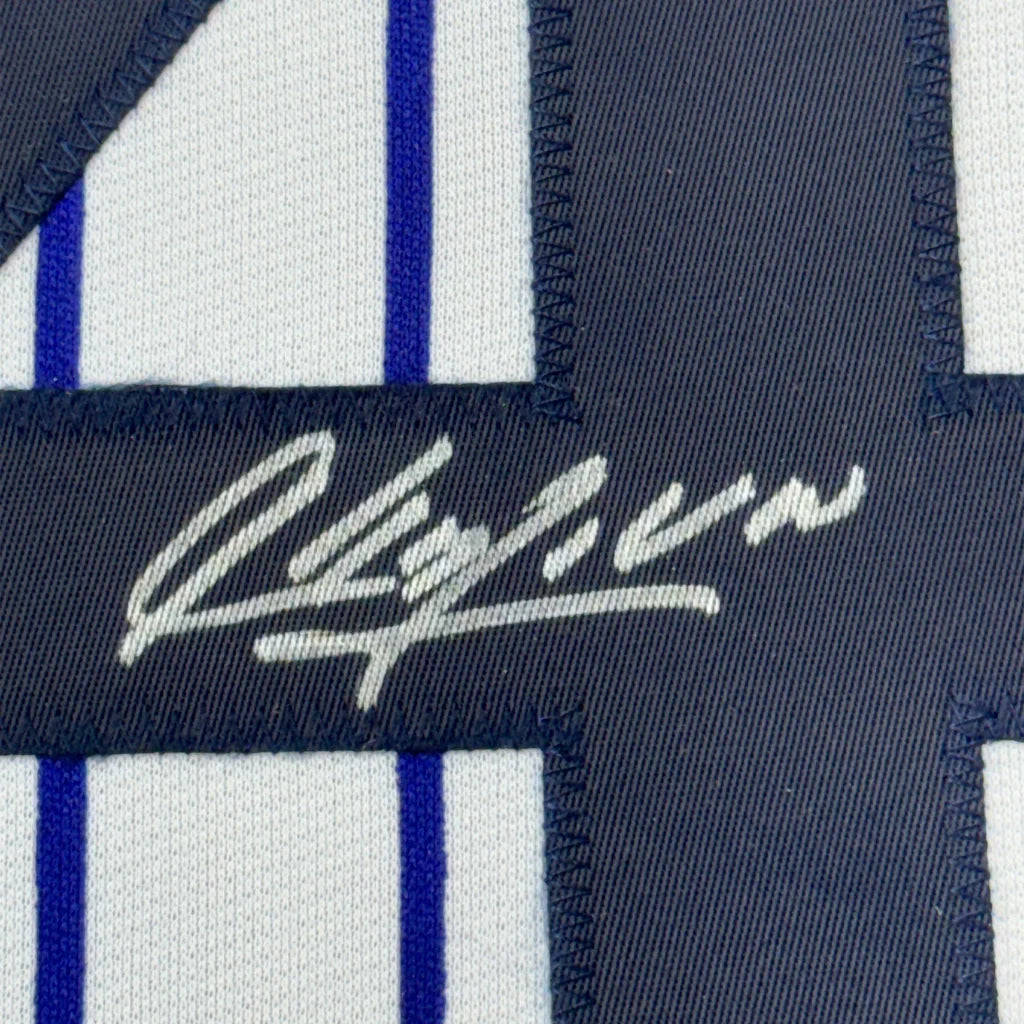 Navy blue and white pinstriped fabric with white embroidered signature on Aroldis Chapman Yankees jersey