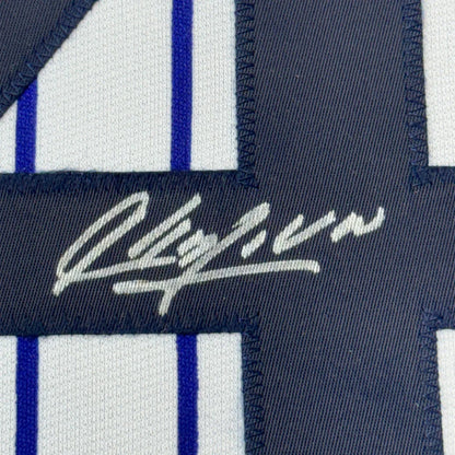 Navy blue and white pinstriped fabric with white embroidered signature on Aroldis Chapman Yankees jersey